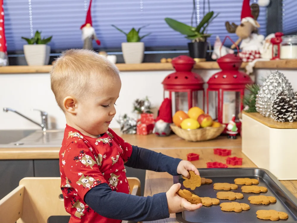 Little boy making Christmas cookies