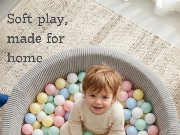 boy in a ball pit