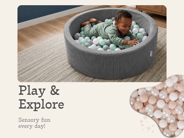 Boy in a grey ball pit