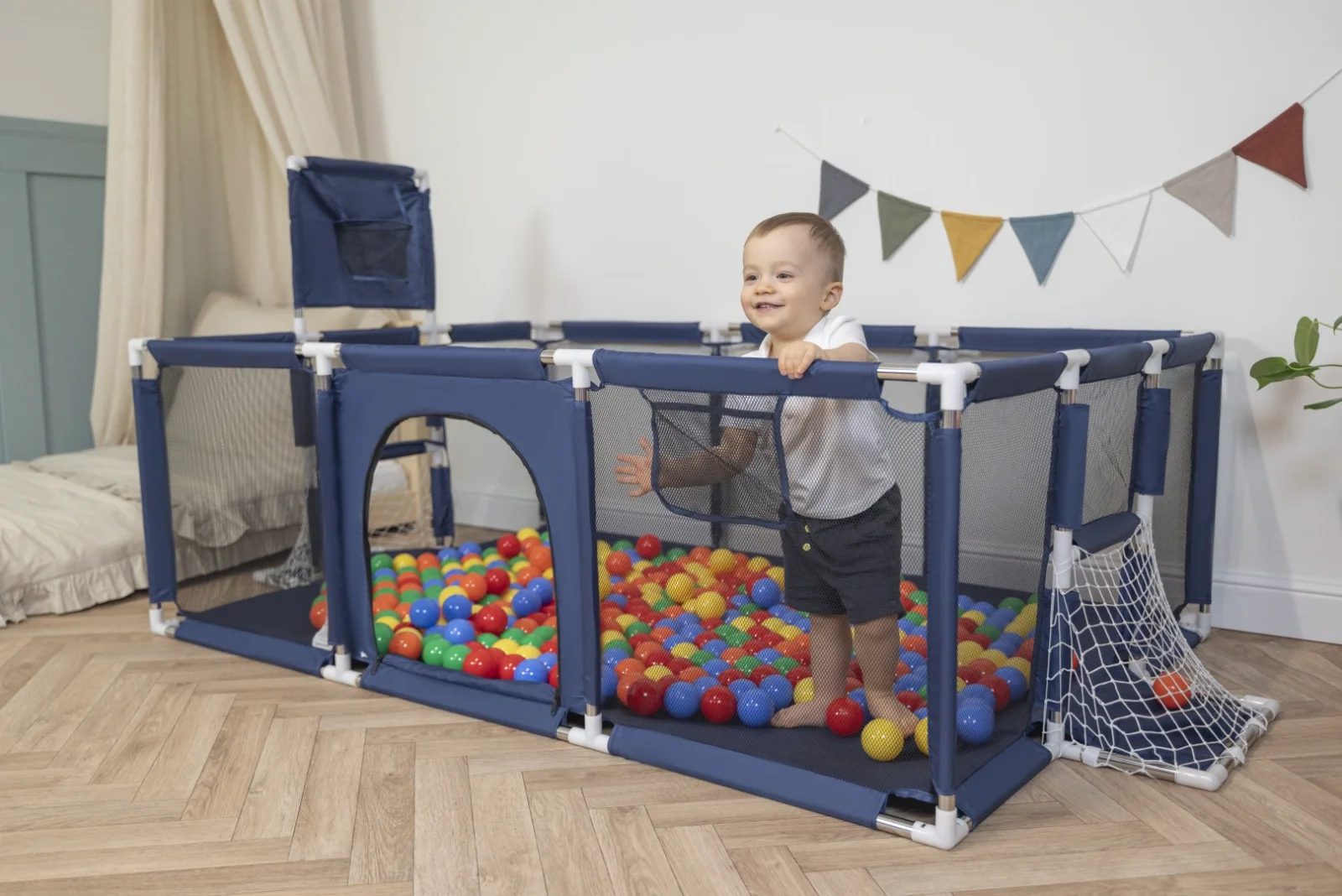 Navy playpen with basketball hoop and football goal